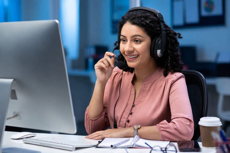 Customer support executive on a headset call